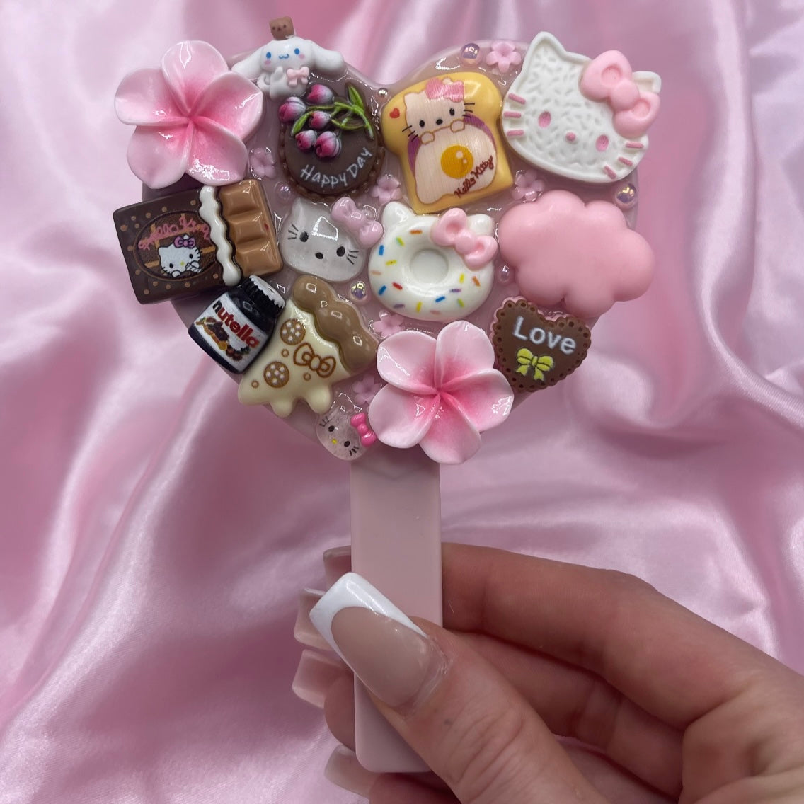 Handheld kawaii junk mirror