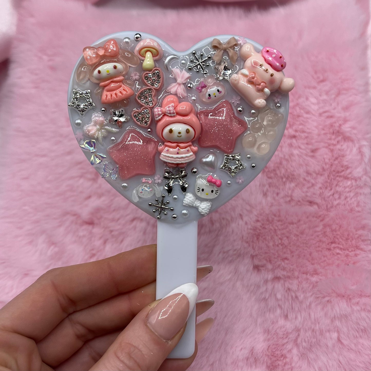 Handheld kawaii junk mirror