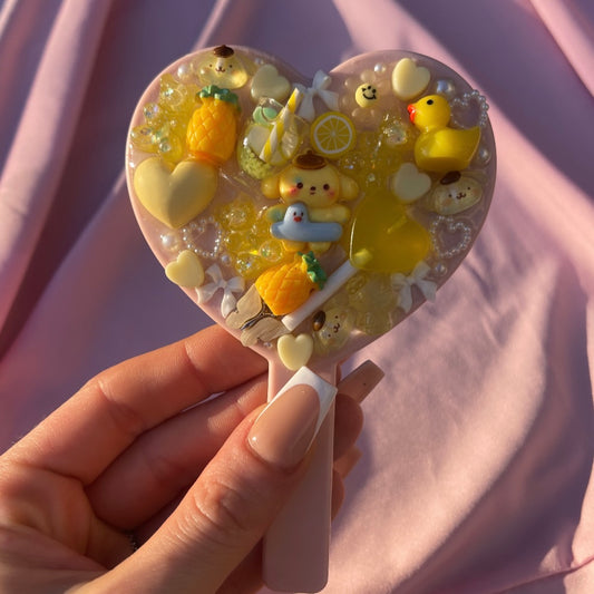 Handheld kawaii junk mirror