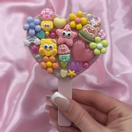 Handheld cartoon junk mirror